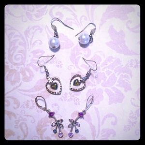 Set of three cream and purple earrings